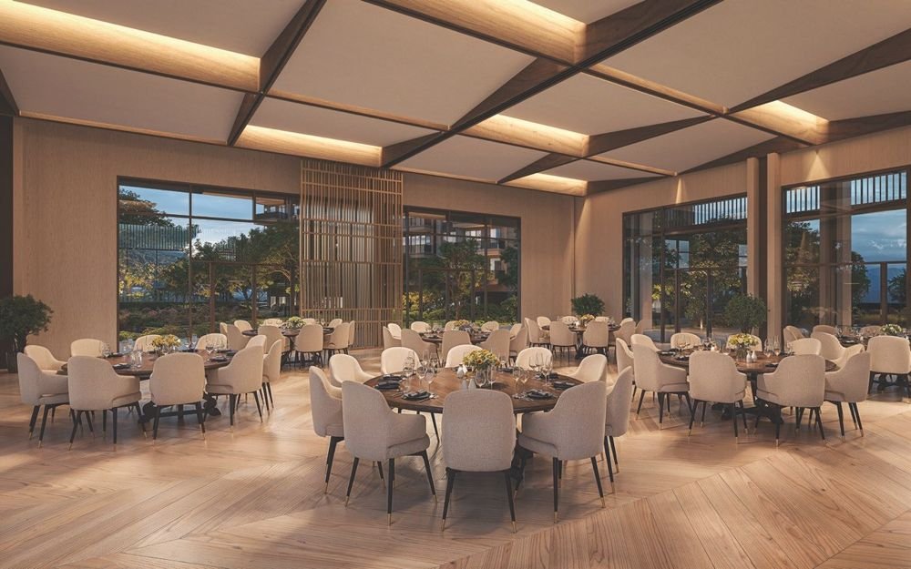 Hall set with round dining tables under a lit timber ceiling