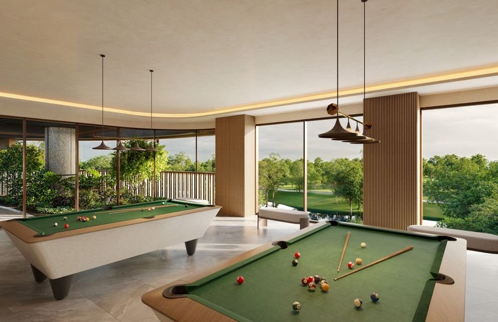 Games room with two pool tables overlooking greenery